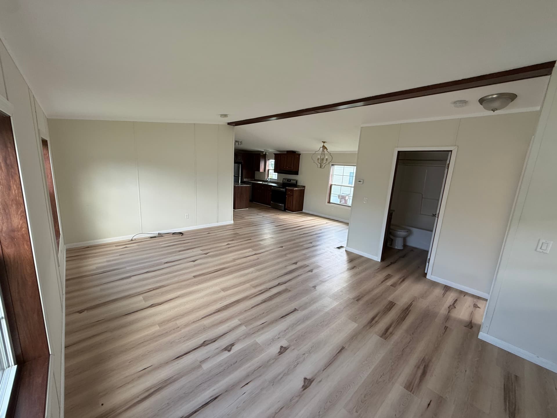 The open living room at 15 Kevin Lane with daylight across the floor