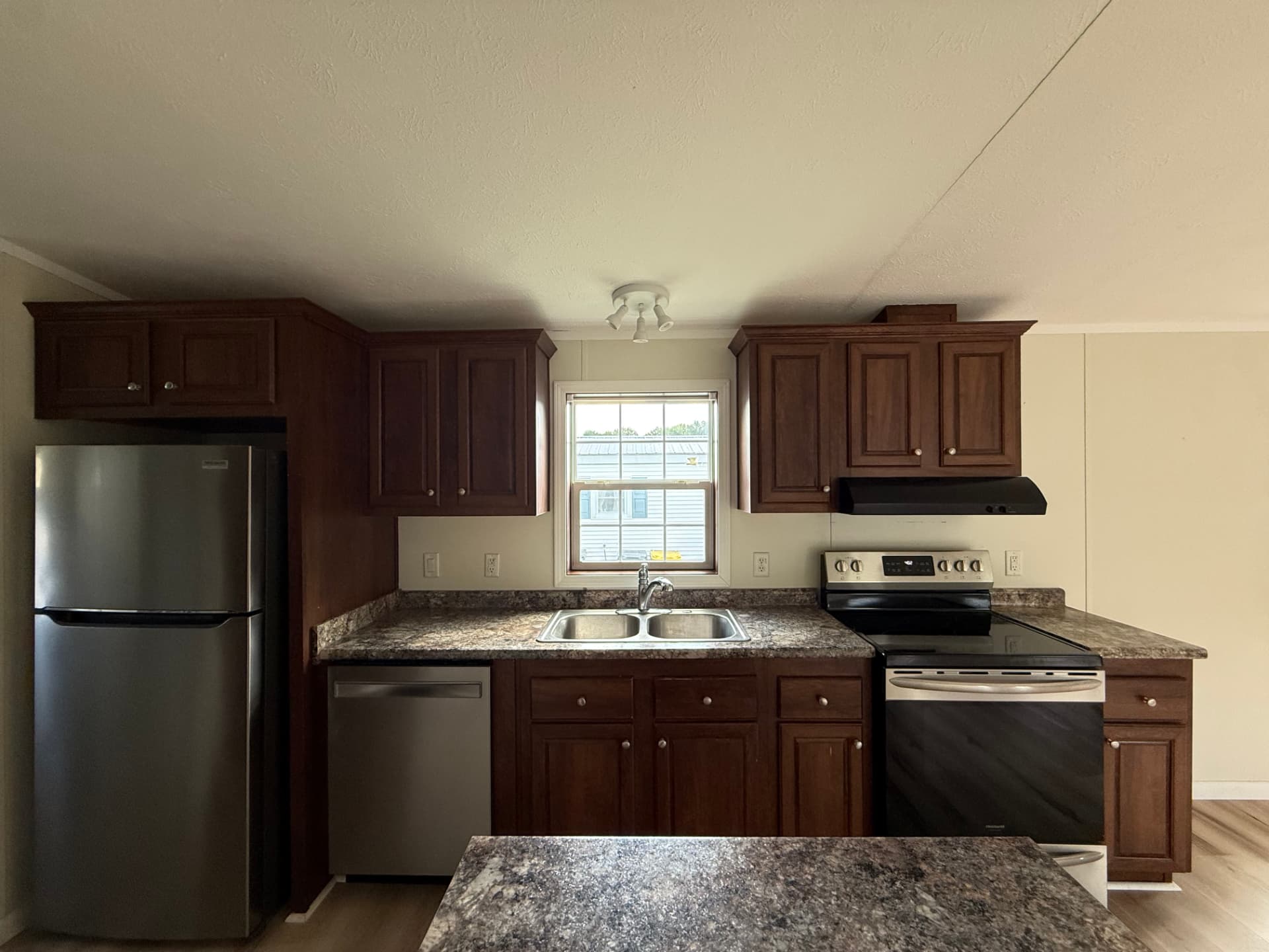 The kitchen at 15 Kevin Lane, open to the living space